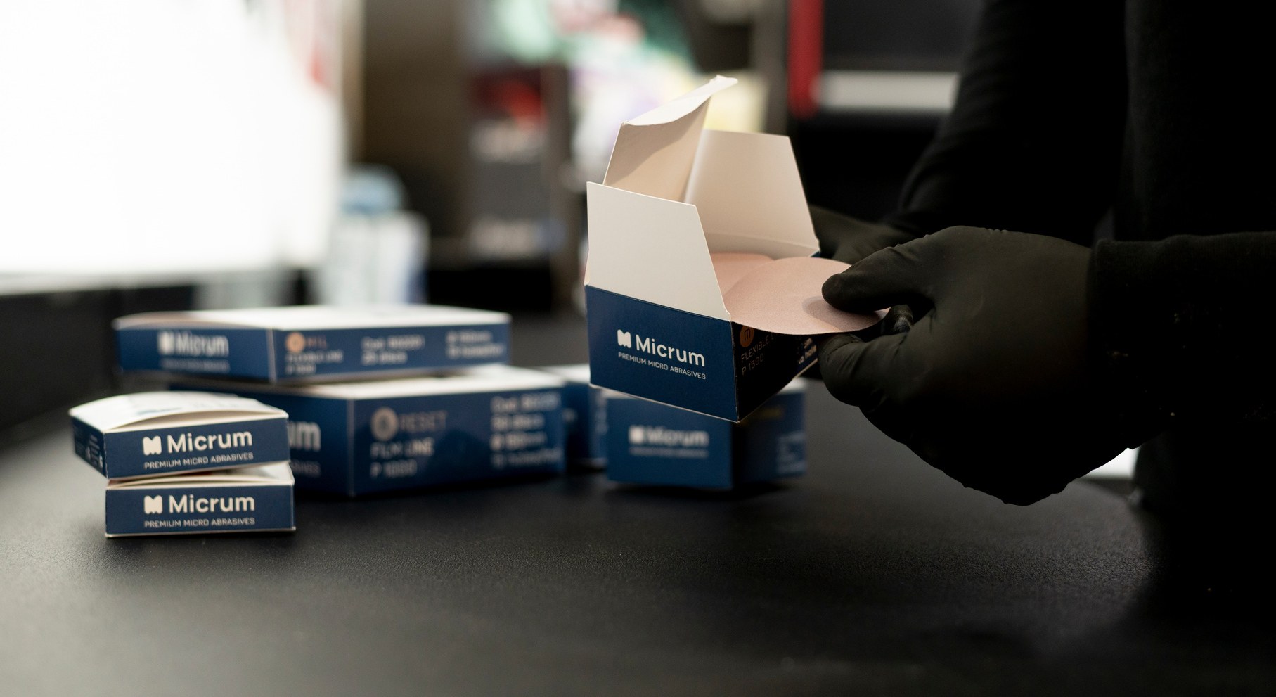 Micrum abrasive discs and boxes on the workshop bench